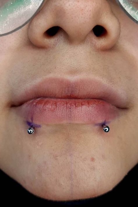 Many of you have heard about snake bites piercing. Some of you may have even considered getting those. However, only a few know all the details concerning the procedure, care, and related things. Do you want to join the ranks of snake bite piercing experts? #snakebitespiercing #snakebitepiercingideas #facepiercing #facepiercingideas #lippiercing Snake Bites Small Lips, Snake Bites On Small Lips, Snake Bite Piercing Men, Snakebites Men, Snake Piercing Lip, Snake Bites Men, Angel Fangs And Snake Bites, Snake Bites Lip Piercing, Snakebite Piercing