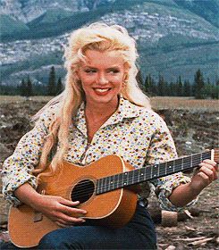 MARILYN MONROE - sings and plays guitar in the movie "River of No Return" 1954 - click on photo for a quick video without sound Marilyn Monroe Fan Art, River Of No Return, Yves Montand, Stars D'hollywood, Jeanne Moreau, Isabelle Adjani, Roy Orbison, Marilyn Monroe Photos, 90's Fashion