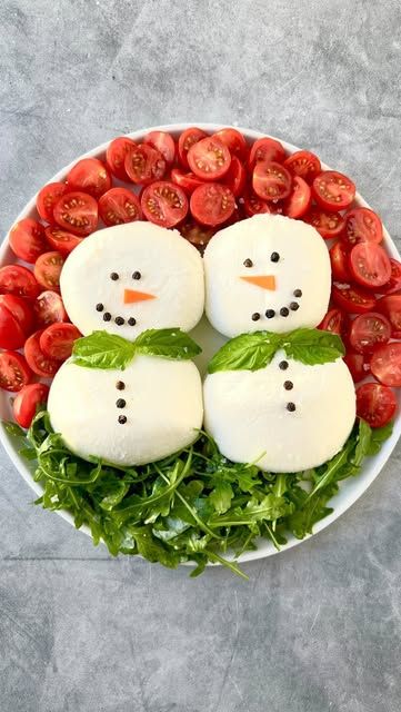 Ain’t Too Proud To Meg on Instagram: "SHARE with a fellow cheese/ burrata lover. Burrata Caprese Snowmen. Directions below ⬇️ I see this on @foodbites and had to try. They came out soooo cute.   INGREDIENTS  4x 4oz burrata balls 19 peppercorns 1/4 carrot, peeled and cut into triangle nose shape 4 basil leaves 1 oz arugula, pre-dressed with olive oil & salt 8 oz cherry tomatoes, chopped, pre-dressed with olive oil & salt flakey salt Olive oil  Balsamic glaze/reduction (optional & not pictured)   INSTRUCTIONS  1. Lay 4 burrata bowls down on a plate, two stacked on each other side by side, resembling snowman.  2. Lay peppercorns down on the burrata balls resembling a face. Lay the carrot slices down for the “noses”.  3. Place the peppercorn “buttons” on the lower burrata balls, and place two Snowman Burrata, Snowman Appetizers, Burrata Caprese, Triangle Nose, Flakey Salt, Nose Shapes, December 23, Balsamic Glaze, Basil Leaves