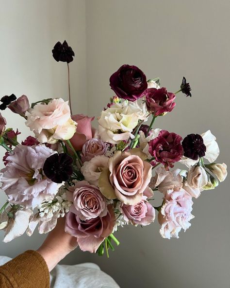 FLORALS BY ADENA | In love with a moody fall palette. Some of my favorite products in these bridesmaid bouquets. Here’s what we used to create them- amnesia... | Instagram Dark Floral Wedding Bouquets, Plum Bouquet Wedding, Simplistic Wedding Flowers, September Wedding Colors Schemes, Moody Bridal Bouquet, Peonies Bridal Bouquet, January Wedding Flowers, Moody Bouquet, Delphinium Bouquet