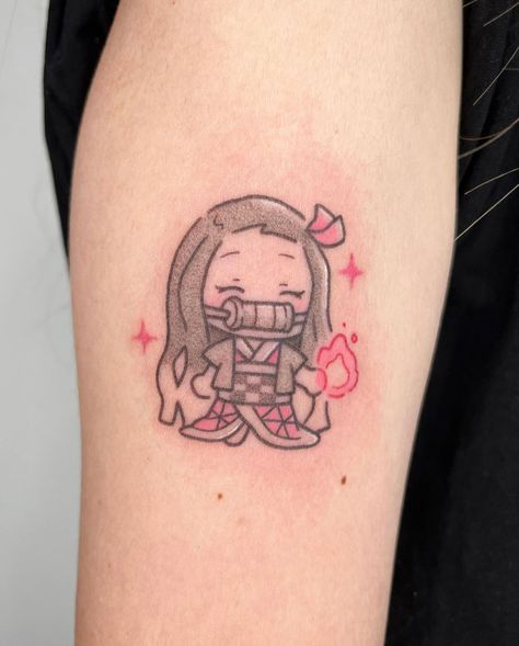 Tattoo by @pigeonpokes_ on Instagram, who is based in Singapore. Small Cute Japanese Tattoos, Cute Naruto Tattoo Ideas Small, Small Nezuko Tattoo, Anime Tattoo For Women, Anime Tattoos Women, Minimal Anime Tattoo, Nezuko Tattoo Ideas, Nezuko Tattoo Design, Minimalist Anime Tattoos