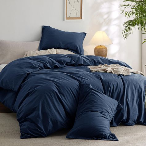 PRICES MAY VARY. Extra Cozy: The 100% cotton outer cover on this comforter set provides exceptional breathability and moisture-wicking properties, ensuring maximum coziness night after night. Ultra Soft: This comforter is prewashed in manufacturing, and filled with extra-fine polyester microfiber to achieve an exquisite softness that's gentle on the skin, delivering all-year-round comfort. Natural Wrinkle: This comforter features a stylish, natural wrinkle that can effortlessly complement any in Navy Blue Comforter Bedroom, Dark Comforter Bedroom, Shades Of Blue Bedroom, Orange And Blue Aesthetic Bedroom, Bedding Sets Blue, Slate Blue Bedroom, Ocean Blue Bedding, Dark Blue Bed, Navy Sheets White Comforter