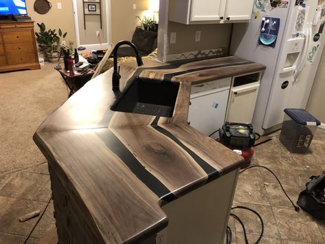 Black walnut epoxy river countertops Epoxy River Countertop, Walnut Epoxy Countertops, Wood And Resin Countertops, Epoxy Countertop Kitchens Best Bar Top Epoxy, Black And Brown Epoxy Countertops, Live Edge Kitchen Island Epoxy, Black Walnut Live Edge Bar Top, Rustic Remodel, Mill Work