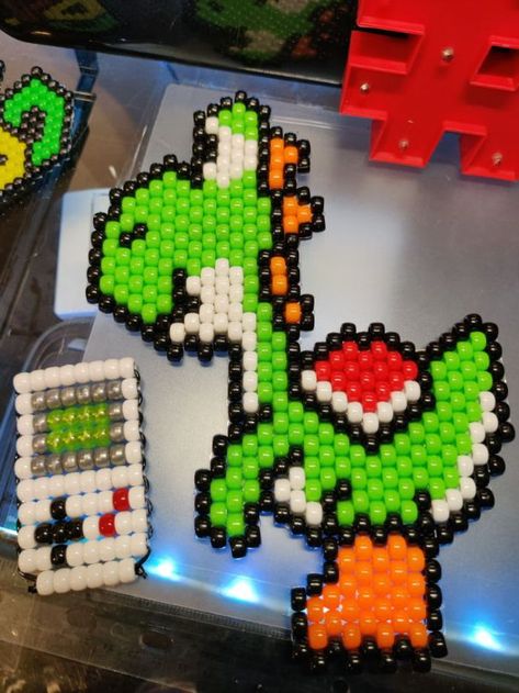 Yoshi and gameboy by TurboBeads - Kandi Photos on Kandi Patterns Mario Kandi, Yoshi Egg, Kandi Inspo, Beaded Brooches, Kandi Patterns, Photo Pattern, Beaded Brooch, Pretty Cool, Laptop Computers