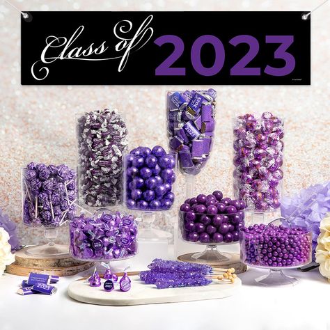 There's no bigger way to celebrate their graduation with this deluxe graduation class of 2023 candy buffet. Each buffet includes a Class of 2023 5-foot banner, 100 wrapped Hershey's Miniatures, Hershey's Kisses with stickers (assembly required), and an assortment of solid color candies (Frooties, Dum Dums Lollipops, Gumballs, Truffles & Candy Sticks.) Candy items are subject to change based on availability. These favors will be the sweetest goodie bags for your guests to take home. Feeds approx. Dum Dums Lollipops, Purple Candy Buffet, Blue Candy Buffet, Pink Candy Buffet, Graduation Candy Buffet, Purple Graduation, 2024 Banner, Chocolate Bar Wrapping, Dum Dums