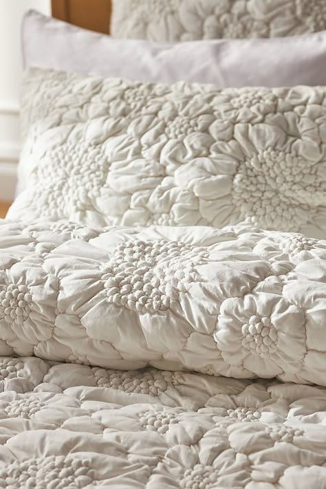 Versatile enough to suit any décor style, this timeless collection is crafted of so-soft cotton jersey, and features a subtly stitched floral motif for a modern touch of texture. Looking for the sweetest of dreams? Read our guide to find the perfect bedding for you, and learn how to care for it season after season. | Dahlia Cotton Jersey Floral Quilt by Anthropologie in White, Size: Q top/bed, Polyester/Cotton/Iron Anthroliving Bedroom, Anthropologie Bedspread, Anthropologie Home Aesthetic, White Quilt Cover, Anthropologie Bedding, Jersey Quilt, Perfect Bedding, Inspire Me Home Decor, Floral Bedding