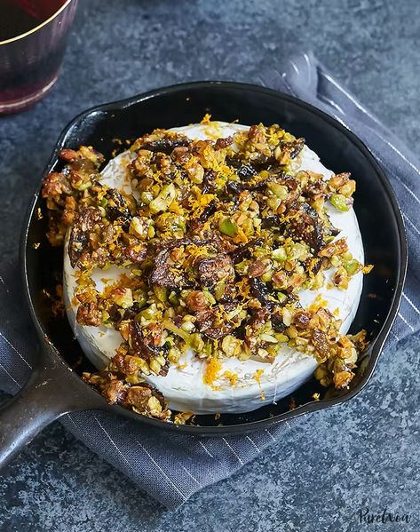 Baked Brie with Figs, Pistachios and Orange - PureWow Baked Brie Recipes, Cheese Recipes Appetizers, Fancy Appetizers, Christmas Appetizers Party, Brie Recipes, Fall Appetizers, Fig Recipes, Party Appetizers, Baked Brie