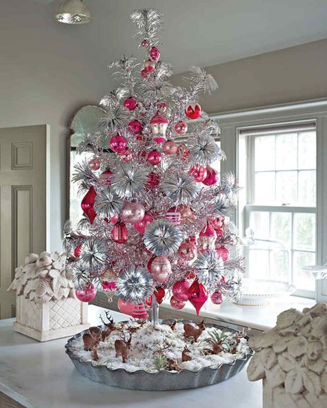 Aluminum Tree Creative Christmas Tree Decorating Ideas | Martha Stewart Living — Forget the electric lights, make your room shine with an aluminum tree filled with removable branches and a central trunk. Christmas Tree Colors, Martha Stewart Christmas, White Christmas Tree Decorations, Amazing Christmas Trees, Faux Christmas Trees, Aluminum Christmas Tree, Tinsel Tree, Creative Christmas Trees, Silver Christmas Tree