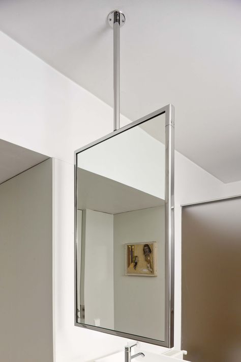 "M" is a suspended mirror that uses the ceiling as its only fixing point. Hanging Mirror From Ceiling Bathroom, Ceiling Mount Mirror, Ceiling Hung Mirror, Suspended Mirror From Ceiling, Hanging Mirror From Ceiling, Suspended Bathroom Mirror, Ceiling Suspended Mirror Bathroom, 70s Bungalow, Suspended Mirror