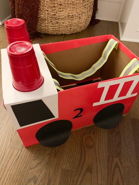 DIY Fire Truck Halloween Costume » Growing Up Kemper Fire Truck Box Costume, Fire Truck Box Diy, How To Make A Fire Truck From Cardboard, Fire Truck Diy Cardboard Boxes, Diy Firetruck Costume, Firetruck Halloween Costume, Fire Truck Costume Diy, Toddler Fire Truck Craft, Diy Fireman Costume Kids