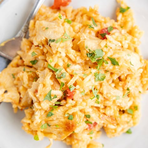 A plate of a serving of this recipe with a fork. Queso Chicken And Rice, White Cheese Sauce, Queso Chicken, White Queso, Flavorful Dinner, Easy Chicken And Rice, Fast Dinner, Nacho Cheese Sauce, Rice White