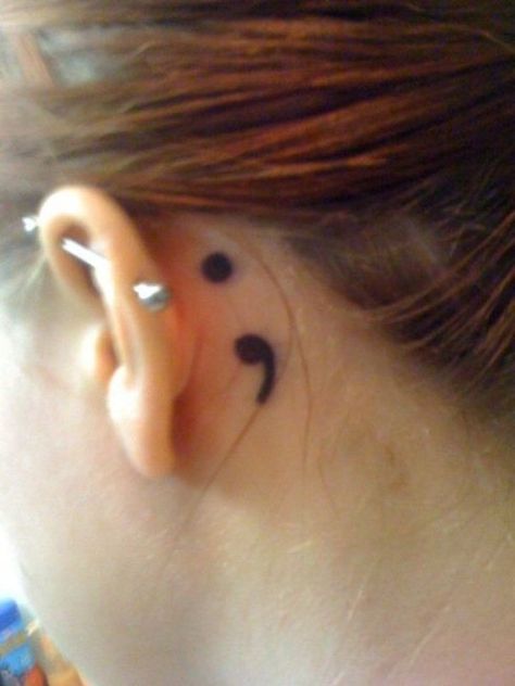 If you want a more discreet place to put your tattoo, you can have it behind your ears. Colon Tattoo, Wörter Tattoos, Tattoo Band, Behind Ear Tattoos, Semi Colon, Hamsa Tattoo, Tattoo Trend, Semicolon Tattoo, Symbolic Tattoos