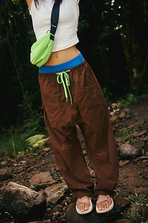 Hike on in these durable, water-resistant pants, featuring a slightly barrel-legged silhouette and easy-access doubled front pockets. **Fit:** Relaxed fit; barrel leg; high-rise **Features:** 100% Nylon fabrication; water-resistant; durable; drawstring adjustable waistband; snap closure fly; doubled front pockets; drop in back pockets; hits just above ankle **Why We | Well Played Pants by FP Movement at Free People, Argon Oil, XS Bouldering Pants Women, Outdoor Pants Women, Yoga Fits, Traveling Clothes, Rock Climbing Pants, Trail Outfits, Rock Climbing Outfit, Activewear Fabric, Camping Fashion