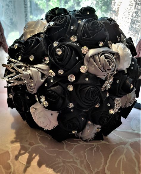 A gorgeous posy style bridal wedding bouquet, handmade with black,white and silver satin flowers and brooches. Underneath the bouquet there is handle bound in a black satin ribbon,blacl trim and crystals. Width: 27 cm Height: 25cm Weight: 0.5kg The colour and the size of this bouquet can be customized. -------------------- International Shoppers: Please send me a message with your location for details about shipping costs as there are faster deliveries available. Add our shop to your Favorites to get the unique coupon codes and discounts! Prom Flowers Bouquet Black Silver Dress, Black White And Silver Wedding Bouquet, Black And Silver Flower Bouquet, Wedding Bouquets Black, Black And Silver Bouquet, Black Wedding Accessories, Black Bouquet Wedding, Black Flower Bouquet, Black And Silver Wedding