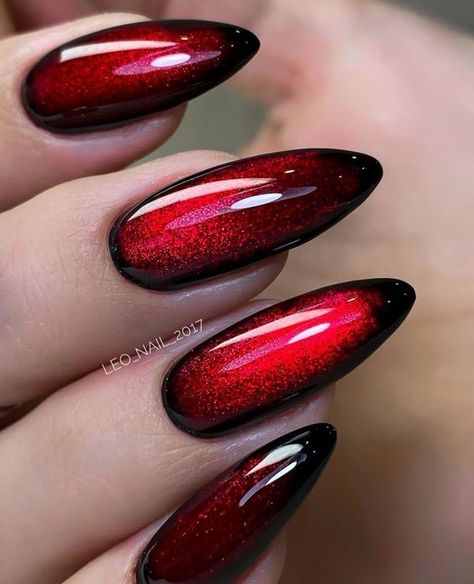 19 Ravishing Red Nail Design Ideas Black And Red Cats Eye Nails, Metal Concert Nails, Blood Red Nails Acrylic, Red Iridescent Nails, Red And Black Cat Eye Nails, Black And Red Cat Eye Nails, Red Cats Eye Nails, Halloween Nails Ombre, Goth Gel Nails