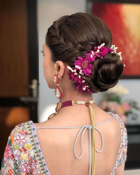 Trending: Floral Buns That Won't Bog You Down | WedMeGood Floral Hair Bun, Floral Bun, Reception Hairstyles, Saree Hairstyles, Blooming Bouquet, Bridal Makeup Images, Bridal Bun, Open Hairstyles, Indian Bridal Hairstyles