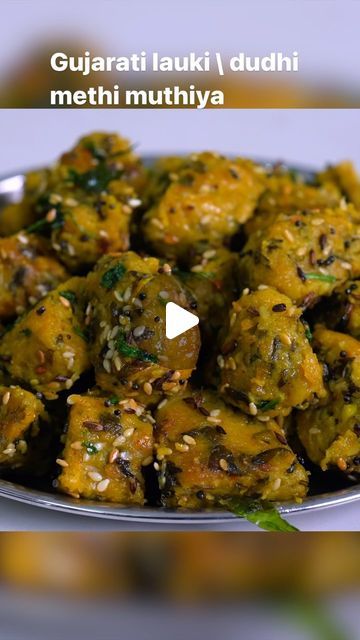 Sheetal on Instagram: "Lauki muthiya | dudhi methi muthiya | Sheetal kitchen 
Ingredients:
350 gm Bottle gourd 
1\4 cup Besan
1\4 Cup wheat flour
1\4 cup jowar flour
1\4 Cup bajri flour
1\4 cup Coarse wheat flour
1 tbs garlic chili paste
1 cup methi leaves
3\4 cup coriander leaves
Salt,sugar and lemon
Red chili powder
Coriander cumin powder
Sesame seeds, hing, rai
Fennel seeds,Cumin seeds
Turmeric powder
Garam masala

#muthiya #dudhimethimuthiya #laukimuthiya #gujaratimuthiya #gujaratisnacks #sheetalkitchen #reels #recipe #recipes #reelitfeelit #reelsinstagram #reels #reelsindia #food #foodblogger #foodie" Dudhi Na Muthiya Recipe, Lauki Muthiya Recipe, Muthiya Recipe Indian, Methi Muthiya Recipe, Methi Leaves Recipe, Bottle Gourd Recipes, Muthiya Recipe, Methi Recipes, Gujarati Snacks