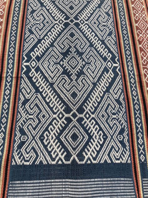 "The Bed / Table Runner - Handwoven thick cotton, using the pahikung technique, where the pattern is developed with a supplementary warp. - Natural dyes showcase pictorial patterns. - Blue, brown and white colours. - 162cm x 44cm (64\" x 17\") - roughly! Sumba & Pahikung - Sumba is one of the Lesser Sunda Islands in the province of East Nusa Tenggara, Indonesia. - Much of the cloth is used for ceremonies, weddings, funerals and passed down through families for generations., with designs illu Batik Bali, Batik Patterns, East Nusa Tenggara, Batik Clothing, Table Bed, Indonesian Batik, Batik Pattern, Traditional Pillows, Bed Runner