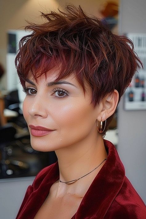 The Best Layered Pixie Cuts of 2024 Chestnut Pixie Hair, Short Burgundy Hair Pixie, 2 Tone Hair Color Ideas For Short Hair, Deep Red Hair Color With Highlights, Burgundy Pixie Cut, Copper Pixie Hair, Burgundy Pixie, Pixie Cut Color Ideas, Cherry Red Pixie Haircut