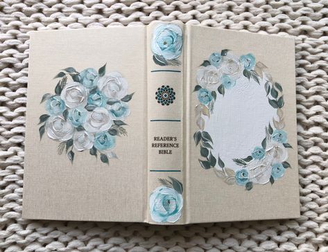 Please scroll and read ALL details for this bible. Thank you!! This gorgeous NKJV bible is already made and ready to ship! It comes with a matching painted cloth bag and a hardback hosanna revival journal. The cream cloth cover of this bible is left uncovered and the blue and white rose and floral design is painted directly on it. This makes for a much more durable bible then one which is fully painted. It can handle daily use! I can put Holy Bible in the front circle of the Bible and name in th Nkjv Bible, Hosanna Revival, Painted Bible, Bible Photos, Wedding Bible, Hand Painted Bible, Grace Alone, Custom Bible, Paint Matching