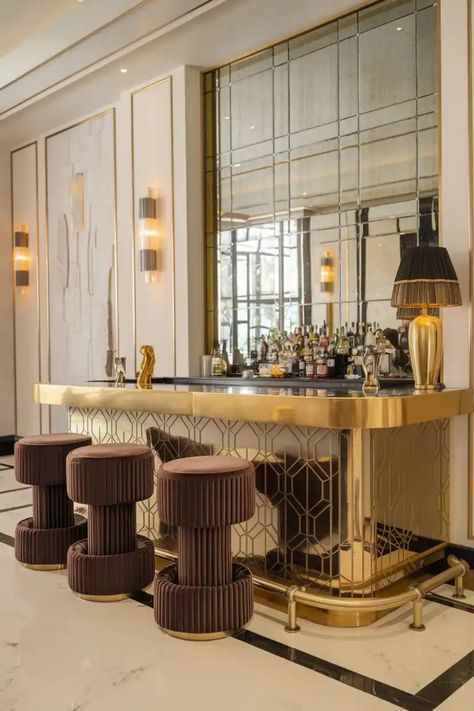 Luxurious hotel bar with mirrored backdrop, gold accents, and plush brown stools. Compact Bar Ideas For Home, Bar With Stools, Compact Kitchens, Chairs For Kitchen Island, Gold Bar Stools, Bar Stool Cushions, Luxury Bar Stools, Transitional Bar Stools, Grey Bar Stools