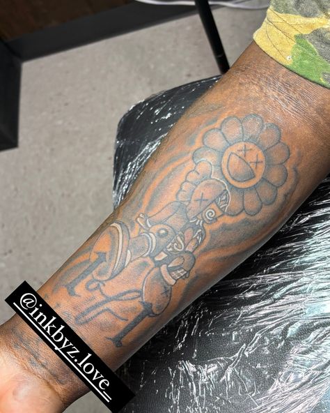 Kaws Theme 1 Of 1 Tattoo ❌ No Neck Tattoos 📍 New Ink Tattoo Shop #newink #shreveporttattooartist #bossiertattooartist #tattoos #femaletattooartist #kawstattoo #lowerarmsleeve Kaws Tattoo Design, 1of1 Tattoo, Kaws Tattoo Sleeve, 1 Of 1 Tattoo, Kaws Tattoo, Best Tattoo Ever, Neck Tattoos, Female Tattoo Artists, 1 Tattoo