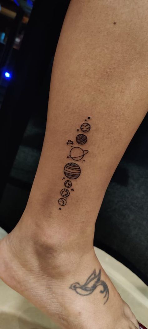 Solar system tattoo Solar System Tattoo Ideas, Small Planet Tattoo Solar System, Tattoo Ideas Planets Solar System, Planet Leg Tattoo, Tattoo Designs On Leg For Women, Patched Sleeve Tattoo Women, Tattoo Ideas Solar System, Solar System Leg Tattoo, Planets In A Line Tattoo