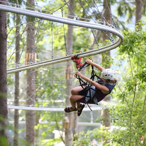 Jungle Zipline is relatively common in unpowered amusement equipment. It is built with the theme of green and health，which is a low-carbon and primitive outdoor exploration project. Players hang on the track through zipline, and use the height difference of the starting point and everyone’s own weight to slide down rapidly, so it is an outdoor sport that integrates adventure, sports, entertainment and challenges. #junglezipline #unpoweredride #carnivalride #equipment #parkride Playground With Zipline, Diy Zipline, Winter Hotel, Kids Zipline, Adult Playground, Wilderness Retreat, Zipline Adventure, Height Difference, Kiddie Rides