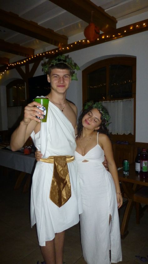 #halloween #halloweencostumeideas #couplehalloweencostumes #halloween2023 Greek God Party Outfit, Greek Couples Costumes, Greek Gods And Goddesses Costumes Couple, Roman Couple Costume, Greek Costume Couple, Toga Couples Costumes, Aphrodite And Ares Costume, Couple Halloween Costumes Greek Gods, Greek Goddess And God Costume