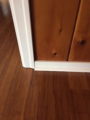 Ever since we bought our old farmhouse, I've been slightly worried about how difficult decorating a room with knotty pine walls might be. I ... Wood Paneling White Trim, How To Update Knotty Pine Walls, Flooring On Walls Ideas Bedroom, Wood Paneling With White Trim, Knotty Pine Walls With White Trim, Flooring For Wood Panel Walls, Knotty Pine With White Trim, Knotty Pine Cottage Interior, Decorating With Knotty Pine Walls