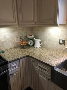 New Traventine back splash, Giallo Ornamental granite complement White Mushroom cabinets. Giallo Ornamental Granite, Kitchen Remode, Kitchen Countertop Storage, Espresso Kitchen Cabinets, Espresso Kitchen, Kitchen Remodel Countertops, Tiles Ideas, Kitchen Countertop Materials, French Country Kitchens