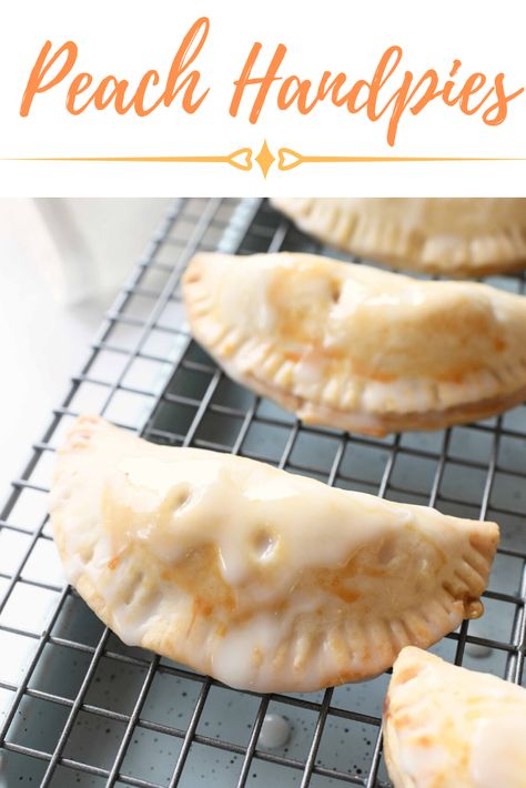 Deliciously glazed, these Peach Hand Pies desserts are so sweet and easy to make. Homemade peach pie filling is nestled in-between flaky pie crust and sealed up perfectly. These are easy to eat and fun to make with minimal ingredients. #handpies #peachpie #peaches #peachpiefilling Homemade Peach Pie Filling, Homemade Peach Pie, Peach Hand Pies, Fresh Peach Recipes, Peach Pie Filling, Hand Pie Recipes, Baked Peach, Hand Pie, Peach Desserts