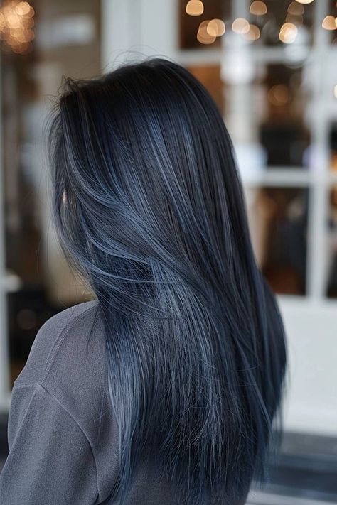 💙 Save for later 👉 Tap to see all chic hair dye ideas for 2025. Starlush Hair Color offers a smoky steel-blue tone perfect for dyed hair inspiration. This pretty hair color idea flatters sleek, long hair and fair skin tones. Consult your colorist about deep conditioning to keep the steel-blue finish shiny and smooth. Hair Dye Lowlights, Brown Hair With Teal Underneath, Steel Blue Hair Color, Brown Hair With Blue Undertones, Grayish Blue Hair, Hair Trends 2025 Color, Gray And Blue Hair, Dark Blue Balayage Hair, Dark Blue Hair Highlights