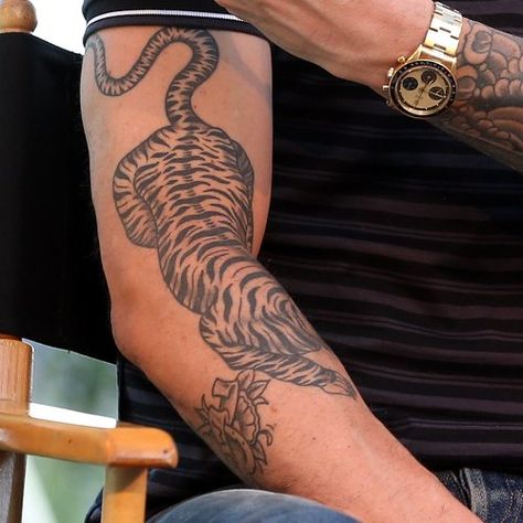 Adam Levine Tattoo Guide: What Do The Maroon 5 Star's Designs Mean? - Capital Tiger Tail Tattoo, Adam Levine Tiger Tattoo, Tiger Tattoo Arm Men, Tiger Arm Tattoo Men, Arm Tiger Tattoo, Tiger Tattoo On Arm, Tiger Tattoo Design Men, Tiger Arm Tattoo, Adam Levine Tattoos