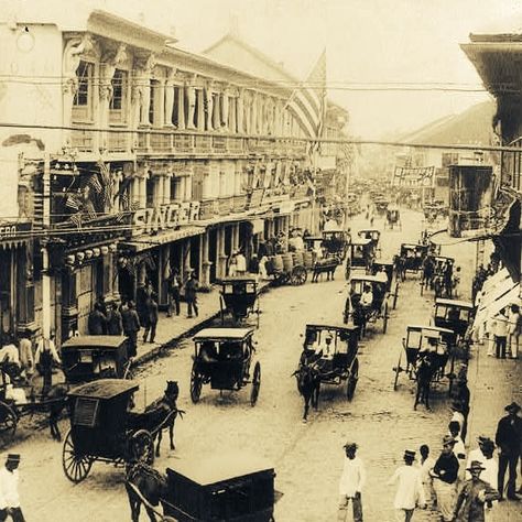 #Philippine_History  . . .  Calle Escolta, circa 1900s; with an American flag hoisted in one of the buildings in celebration of the 4th of July. Philippine Landmarks, Binondo Manila, Philippine Architecture, Filipino Architecture, Appalachian History, Philippine History, Treaty Of Paris, Reference Pose, Filipino Art