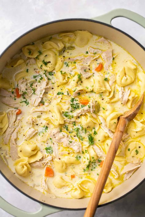 This Creamy Chicken Tortellini Soup is a dreamy take on classic chicken noodle soup, with cheesy tortellini and a creamy, comforting broth. Pair this with some warm, crusty bread and you have the perfect winter meal! Chicken Tortillini Soup, Tortellini Soup Crockpot, Creamy Chicken Tortellini Soup, Creamy Chicken Tortellini, Classic Chicken Noodle Soup, Cheesy Tortellini, Creamy Tortellini Soup, Spinach Tortellini Soup, Chicken Tortellini Soup