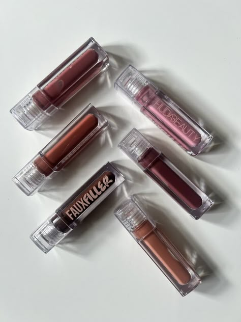 Huda Beauty's New $19 Lip Gloss Is Viral For a Reason Huda Beauty Faux Filler Lip Gloss, Huda Beauty Lip Gloss, Trendy Lip Gloss, Huda Beauty Lip, Huda Kattan, Laneige Lip Sleeping Mask, Makeup Photography, Dry Lips, Setting Powder