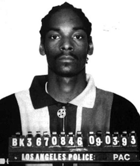 The LAPD came to the show looking for Snoop. He was able to evade them and turned himself in after the show. | Remembering The 41 Greatest Moments From The 1993 VMAs Celebrity Mugshots, Suge Knight, George Clinton, Chris Tucker, Joe Louis, Mickey Rourke, Joe Armstrong, Snoop Dog, Billie Joe Armstrong