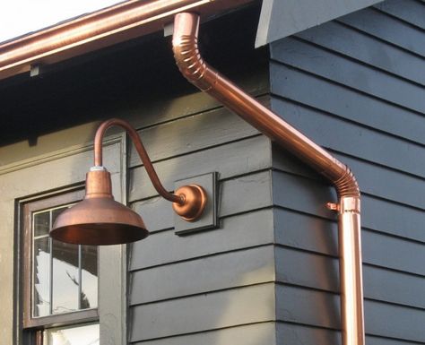 Don't forget the exterior of your home. A weathered brass pendant hanging from a porch or copper gooseneck lights framing a doorway instantly creates an ... 1920s Craftsman, Gooseneck Lighting, Farmhouse Exterior Colors, Barn Light Electric, Pintura Exterior, Brick Exterior House, Craftsman Style Home, Modern Farmhouse Exterior, Copper Lighting