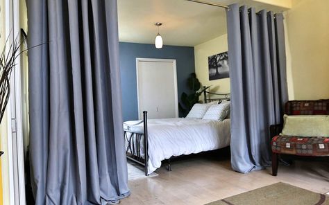 Curtains dividing a bedroom and a living room. Ceiling Mount Curtain Rods, Hanging Room Divider, Curtain Rods And Hardware, Hanging Curtain Rods, Divider Ideas, Divider Curtain, Hanging Room Dividers, Room Divider Curtain, Wooden Room