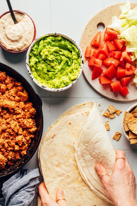 The ULTIMATE vegan burrito, inspired by a Crunchwrap! Smoky tofu taco meat, creamy white bean queso, crunchy tortilla chips, vibrant guacamole, and fresh veggies. Vegan, gluten-free optional, and ready in just 30 minutes! #minimalistbaker #vegan #burrito #crunchwrap Tofu Taco Meat, Burger Wrap, Dinner Mexican, Quick Guacamole, Burrito Wrap, Vegan Burrito, Minimalist Baker, Yummy Meals, Vegan Mexican