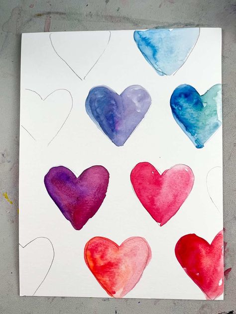 This easy Valentine's painting idea is a great for kids and adults. Learn how to use watercolor paint to make a fun rainbow heart painting. Watercolor Heart Painting For Kids, Q Tip Heart Painting, Watercolour Heart Painting, Watercolor Hearts Valentines Day, Watercolor Valentines Art, Valentine Drawings Art, Watercolor Valentine Cards Diy, Valentine’s Day Crafts For Adults, Watercolour Valentine Cards