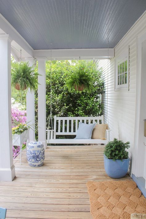 white porch swing, Stripes & Whimsy, Katie Vail, classic style, affordable style, furniture DIY, motherhood, clean beauty, home decor, fitness, maternity style, thrifting, travel guide, military family, lifestyle blogger, blogger style, east coast style Fairy Core Bedroom, Blob Mirrors, Front Porch Addition, Illustration Tips, Home Decor Ideas Kitchen, White Porch, Front Porch Swing, Southern Porches, Cottage Porch