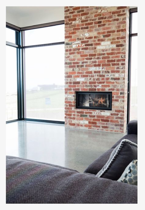 Modern Brick Chimney, Gas Brick Fireplace, Red Brick Chimney Living Room, Reclaimed Brick Fireplace, Burnished Concrete Floor, Exposed Brick Fireplace, Burnished Concrete, Exposed Brick Fireplaces, Brick Feature Wall