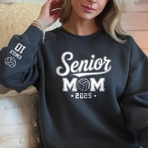 Show your support for your star athlete with our personalized volleyball mom sweatshirt. This customized volleyball mom sweater is perfect for proud parents celebrating their senior volleyball player's achievements. Ideal for senior night gifts, this comfortable senior Sweatshirt can be tailored with your loved one's name and number, making it a memorable keepsake for the class of 2025.