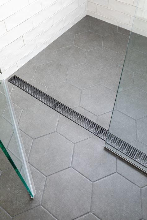 Tiled Bathroom Floors And Showers, Big Tile In Shower Floor, Small Grey Hexagon Tile Bathroom, Continuous Bathroom Shower Floor, Seamless Bathroom Shower Floor, Walk In Shower With Hexagon Tile, Large Tile For Shower Floor, Light Gray Hexagon Tile Bathroom, Light Gray Hexagon Tile Bathroom Floor