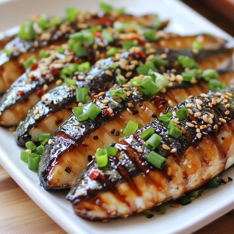 🐟🔥 Enjoy the smoky, savory goodness of Korean Grilled Mackerel—a flavorful and easy-to-make Korean favorite! 😋 #KoreanGrilledMackerel #KoreanSeafood Korean Grilled Mackerel Ingredients: Mackerel fillets (4 pieces) Soy sauce (3 tbsp) Sesame oil (2 tbsp) Garlic (3 cloves, minced) Ginger (1-inch piece, minced) Green onions (2, chopped) Red chili flakes (1 tsp, optional) Instructions: Mix soy sauce, sesame oil, garlic, ginger, and chili flakes in a bowl. Marinate mackerel fillets in the mixtu... Korean Mackerel, Grilled Mackerel Fish Recipes, Japanese Mackerel, Misoyaki Butterfish Recipe, Korean Grill, Grilled Mackerel, Smoked Mackerel, Cozy Fall Recipes, Instagram Recipes