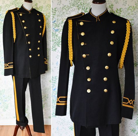 "CB#1 This vintage marching band Uniform is so sleek with so many great details. Rare and hard to find complete uniforms, especially one this old. -Label: BLUMENTHAL uniform company Seattle -made in the USA -This uniform seems to be prior to the 1940's, it does seem very old. Like even 20's or Titanic era. -Fabric is thick and sturdy in black with gold yellow banding, feels like woven cotton -There is a bright yellow stripe down the pant legs -There are shoulder epaulettes with large golden brai Space Captain, Marching Band Uniforms, Band Uniforms, Shoulder Epaulettes, Drum Major, History Fashion, Young Black, Marching Band, Yellow Stripes