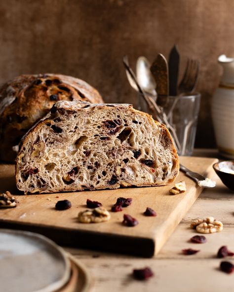 Indulge in the irresistible flavors of our Cranberry Walnut Sourdough Bread, the perfect fusion of tart cranberries and earthy walnuts. Get this sourdough bread recipe on makeitdough.com. Cranberry Sourdough, Flavoured Sourdough Bread, Cherry Sourdough Bread, Cranberry Walnut Sourdough Bread, Cranberry Walnut Sourdough, Cranberry Walnut Sourdough Bread Recipe, Cranberry Walnut Artisan Bread Recipe, Fig And Walnut Sourdough Bread, Sourdough Bread Food Photography