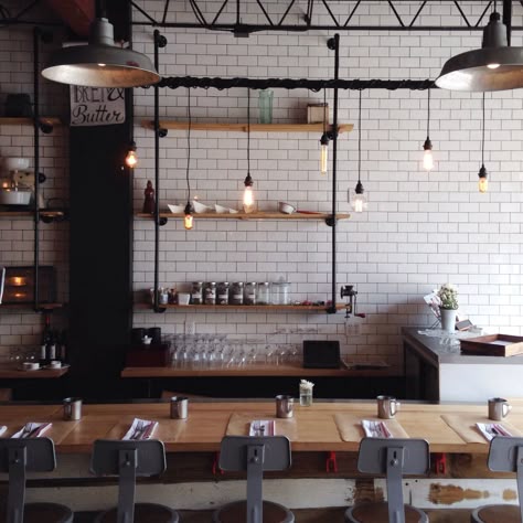 bread & butter | coral gables, florida Café Design, Industrial Cafe, Industrial Kitchen Design, Industrial Restaurant, Cafe Lights, Subway Tiles, Brick Walls, Industrial Kitchen, White Brick